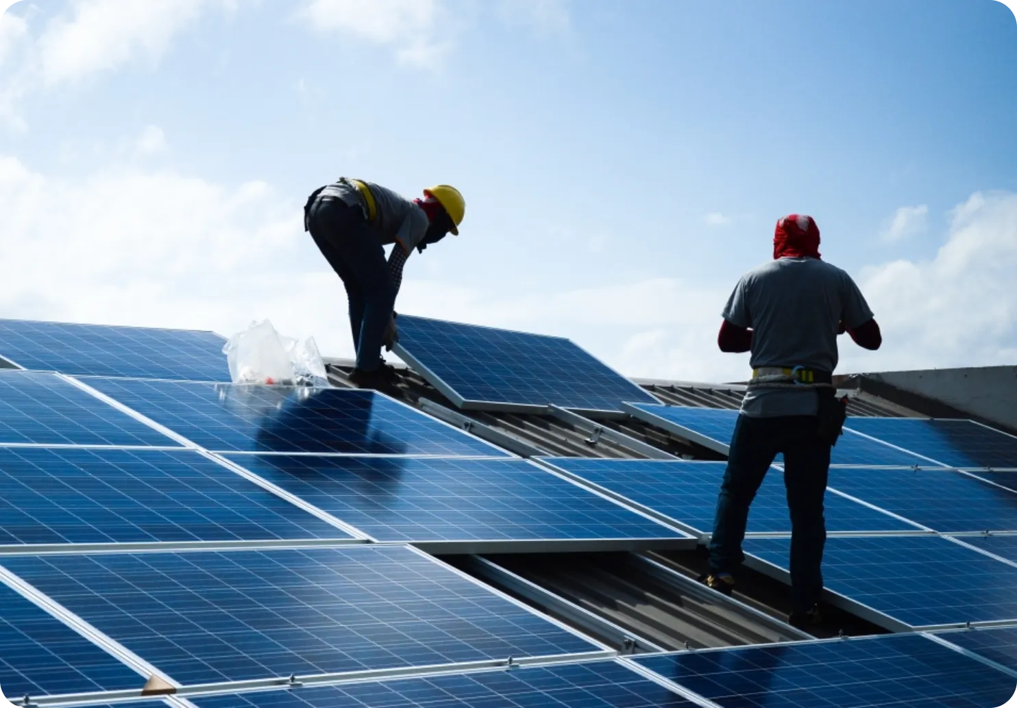 workers installing solar panels